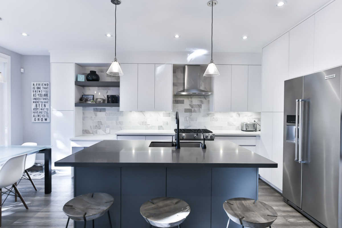 kitchen remodel with black and blue island